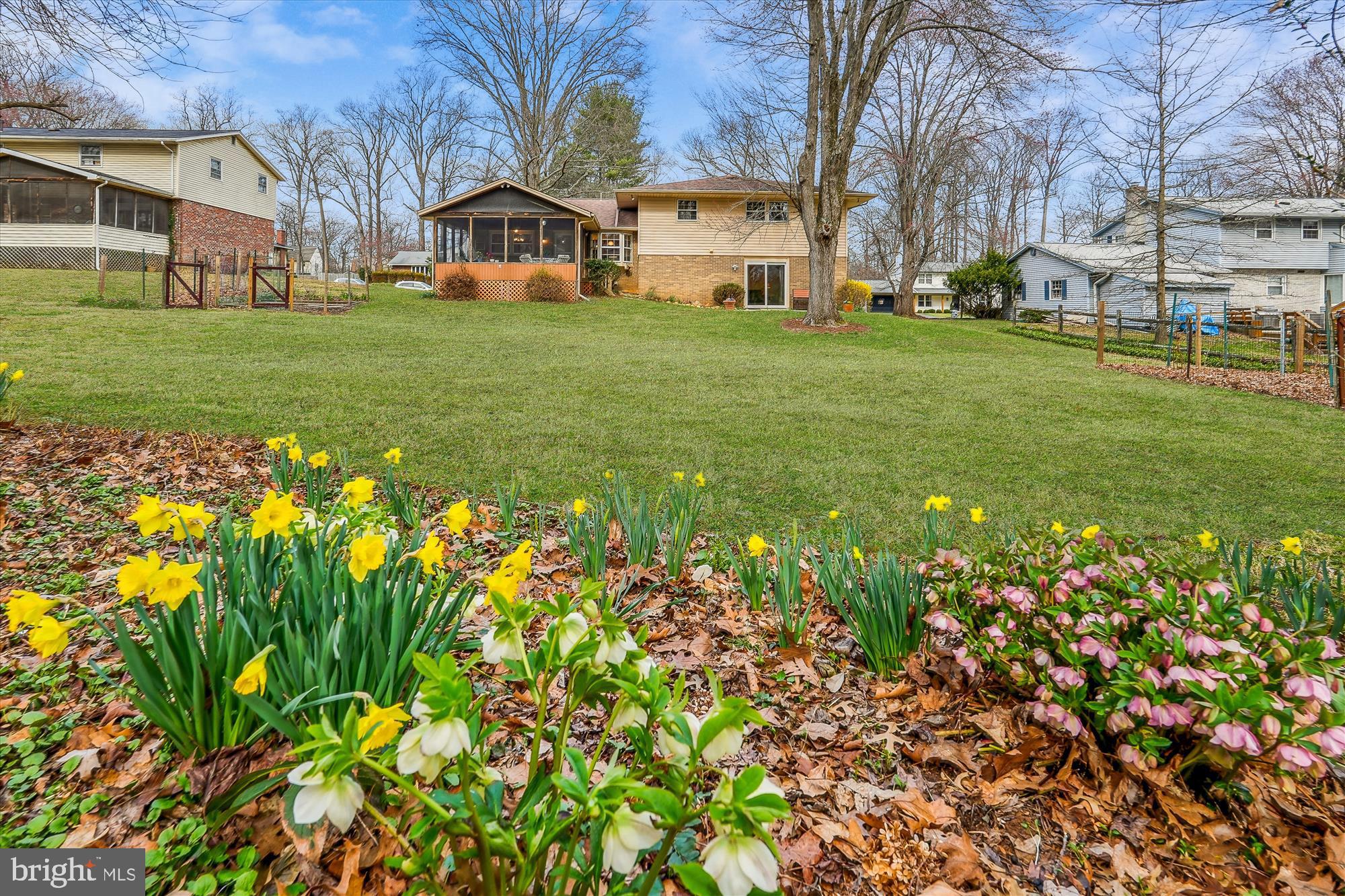 16523 Kipling Road Rockville, MD 20855 - Photo 3 of 50 a front view of a house with a garden