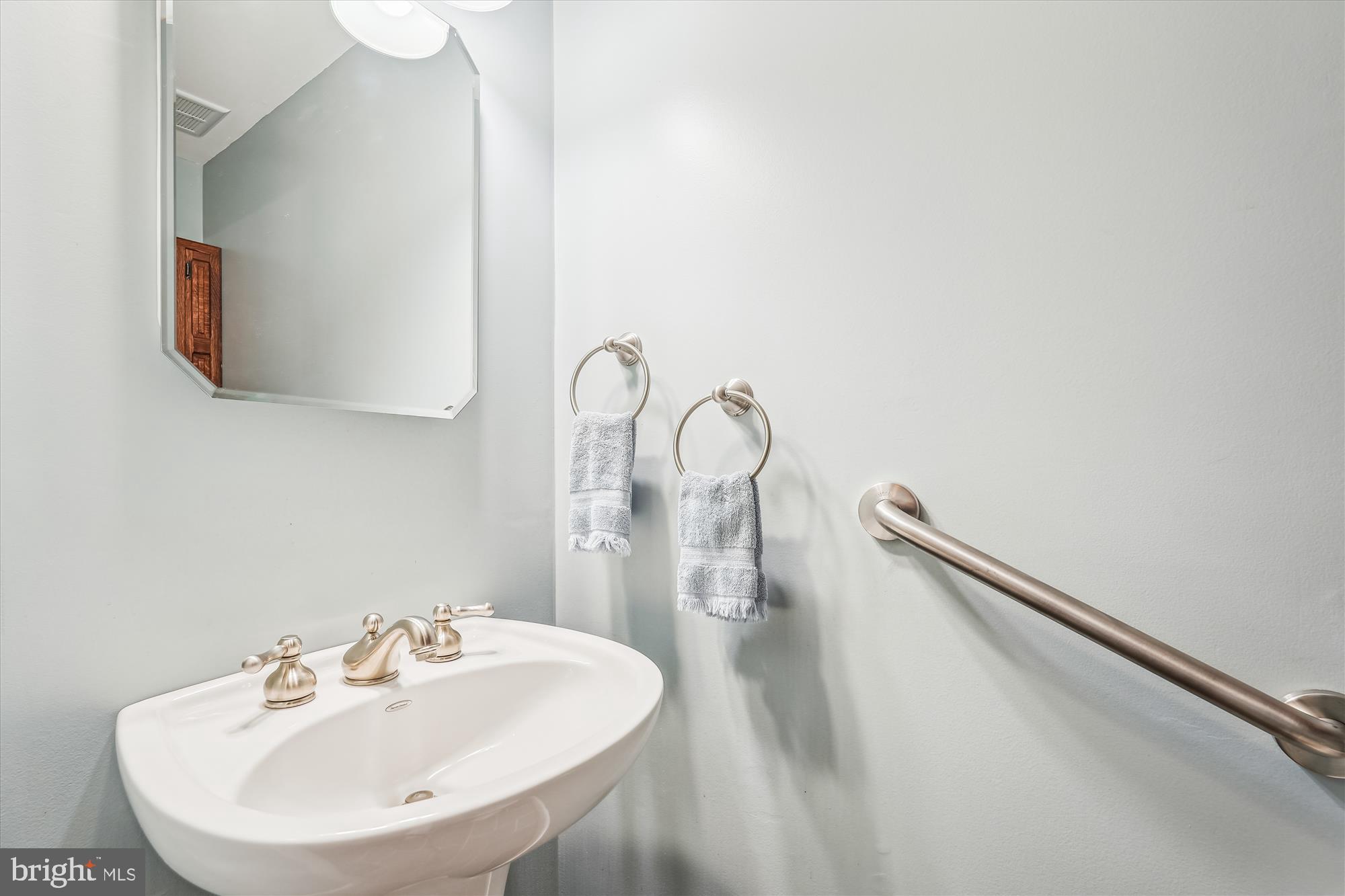 16523 Kipling Road Rockville, MD 20855 - Photo 34 of 50 a bathroom with a sink and mirror