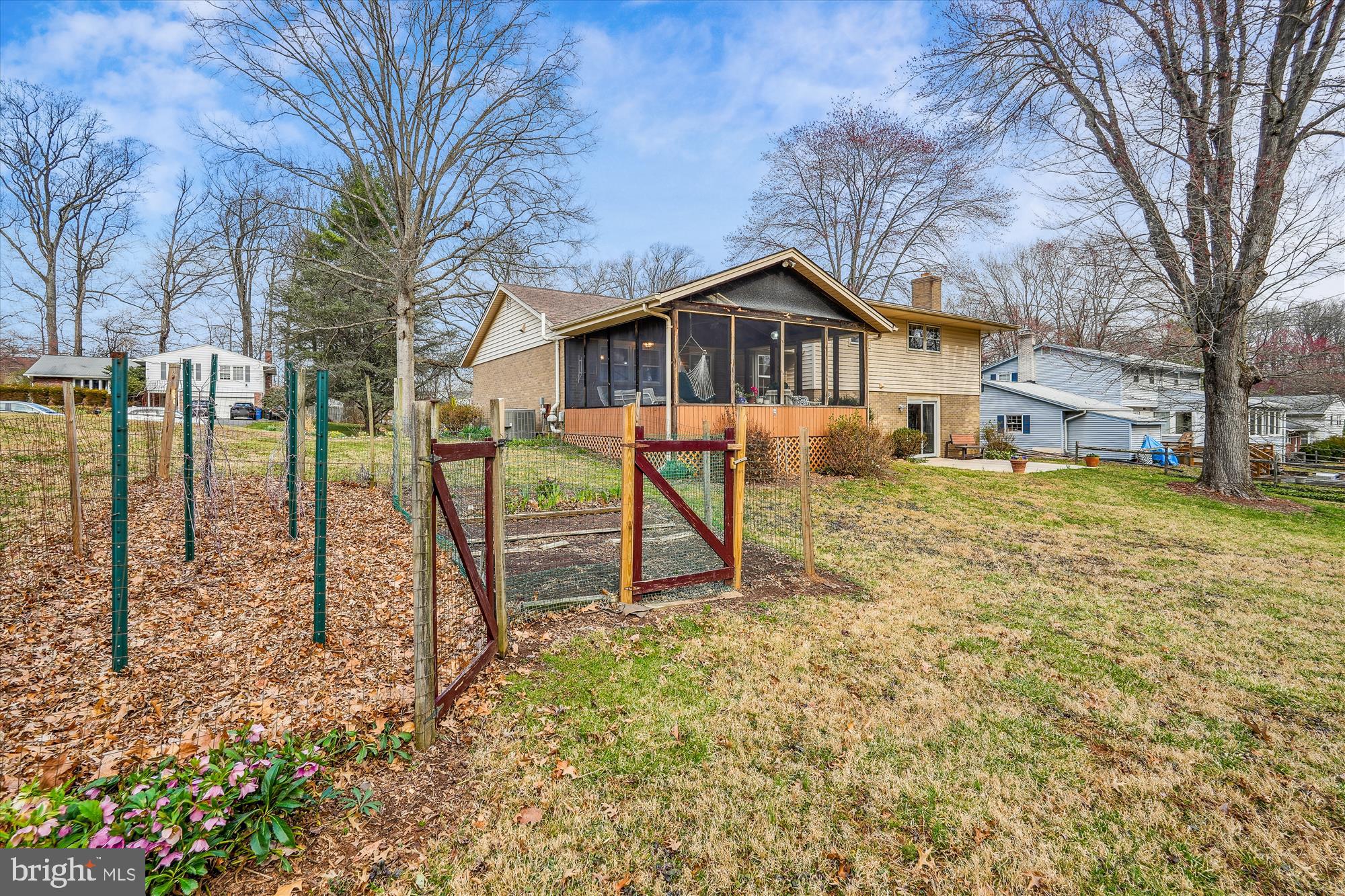 16523 Kipling Road Rockville, MD 20855 - Photo 45 of 50 a front view of a house with a yard