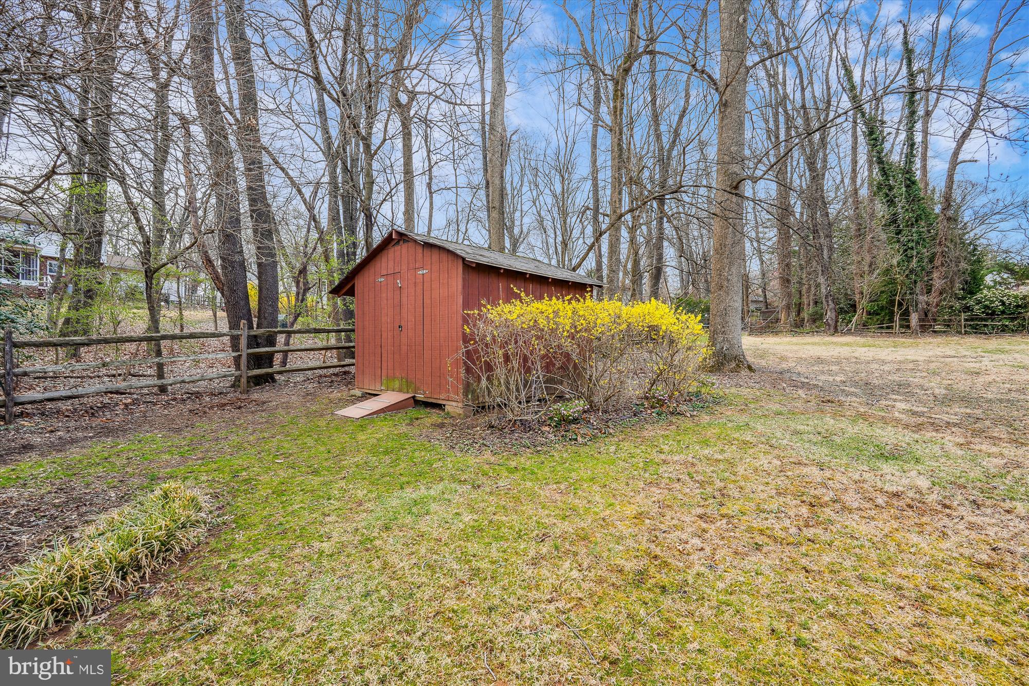 16523 Kipling Road Rockville, MD 20855 - Photo 46 of 50 a backyard of a house with a yard and garage