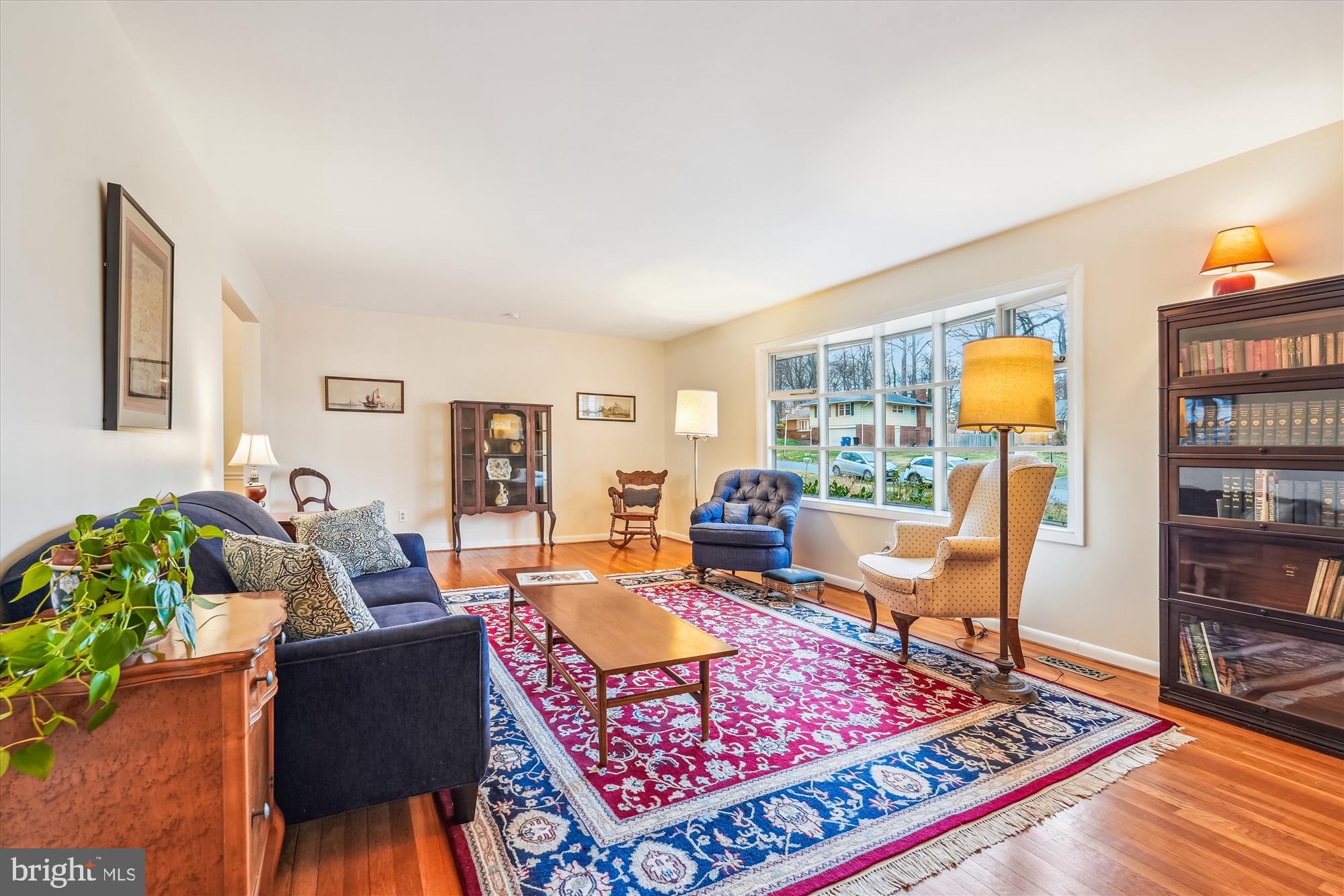 16523 Kipling Road Rockville, MD 20855 - Photo 5 of 50 a living room with furniture a rug and a bookshelf