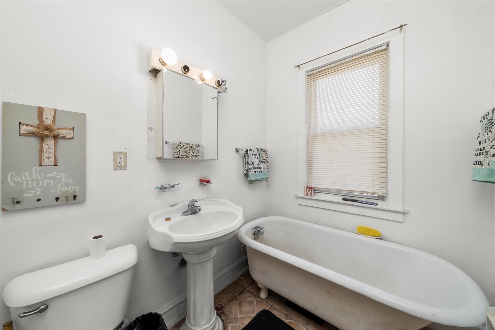 5758 South Honore Street Chicago, IL 60636 - Photo 15 of 57 a bathroom with a sink a toilet and shower