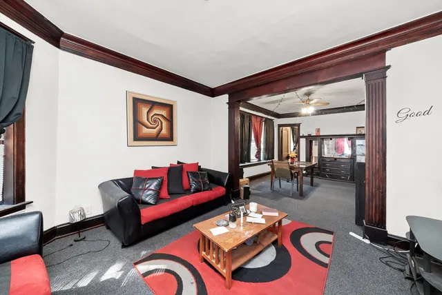 a living room with furniture and rug