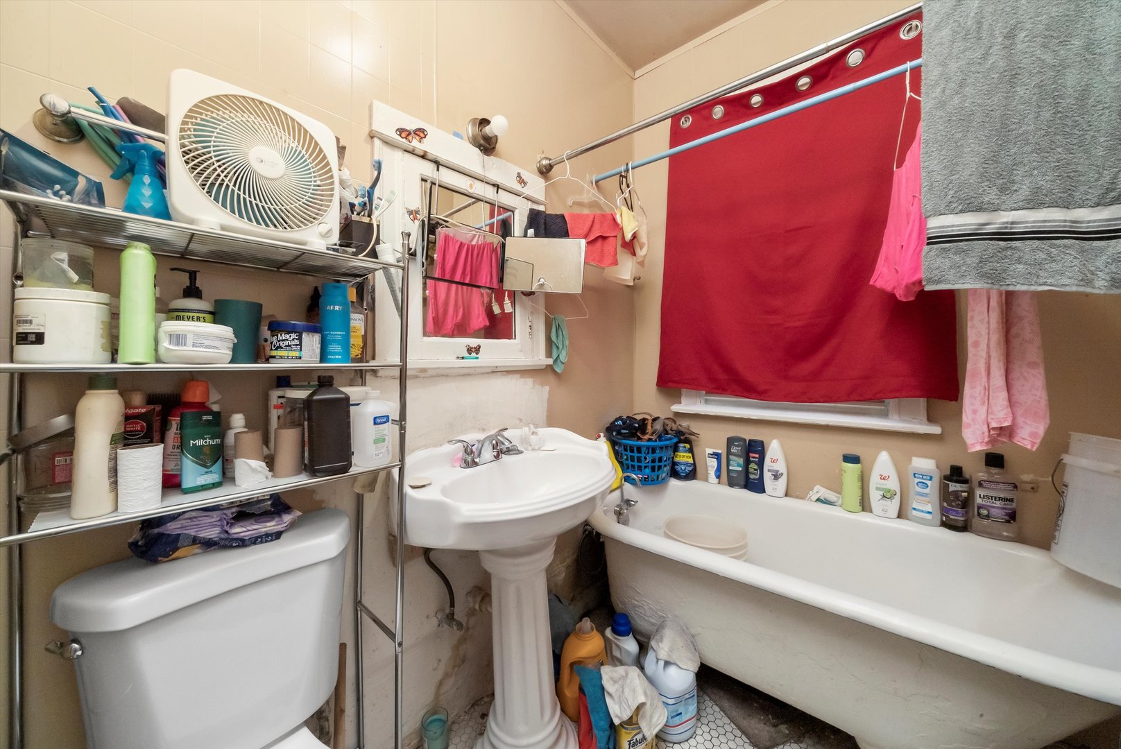 5758 South Honore Street Chicago, IL 60636 - Photo 25 of 57 a bathroom with a sink a vanity and a mirror