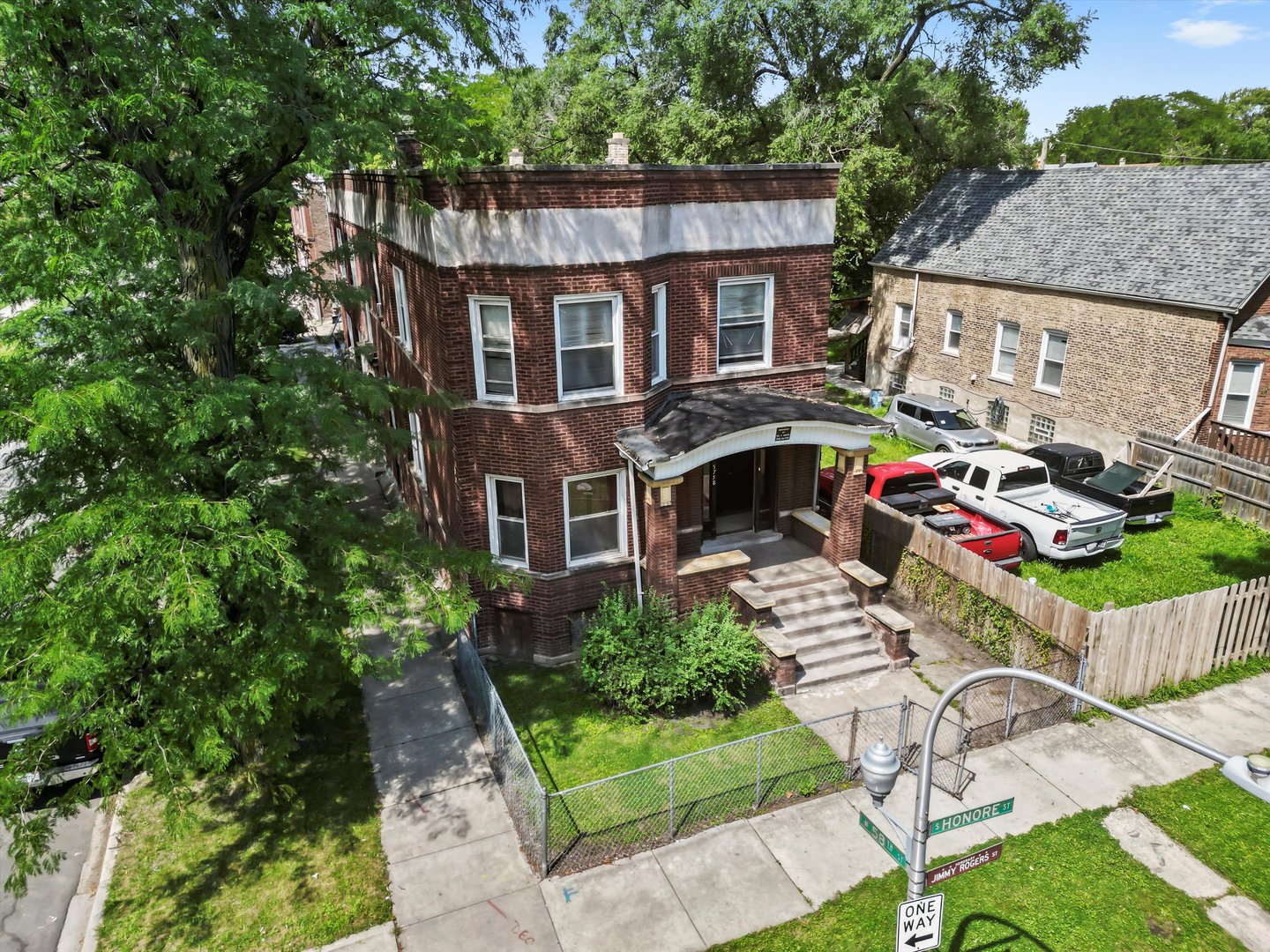 5758 South Honore Street Chicago, IL 60636 - Photo 3 of 57 a front view of a house with garden