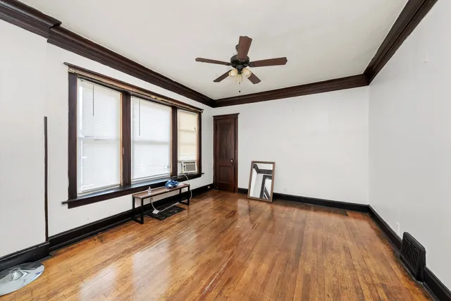 a view of a room with gym equipment and a large window