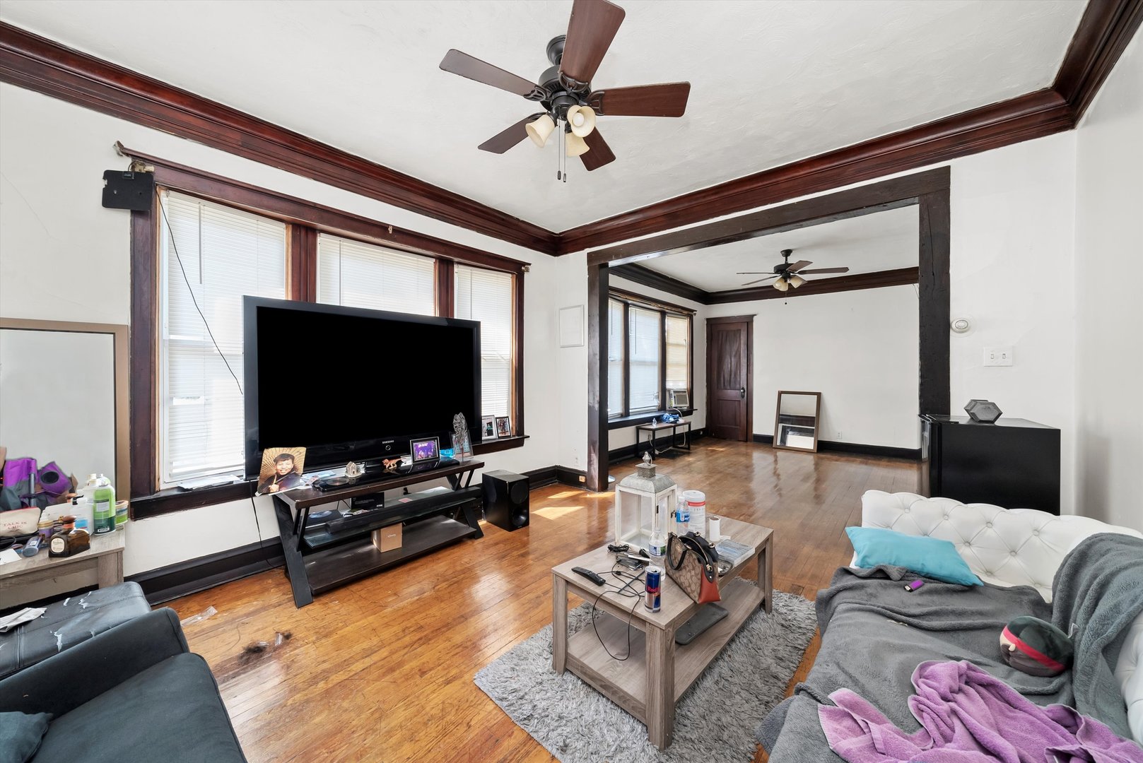 5758 South Honore Street Chicago, IL 60636 - Photo 35 of 57 a living room with furniture and a flat screen tv