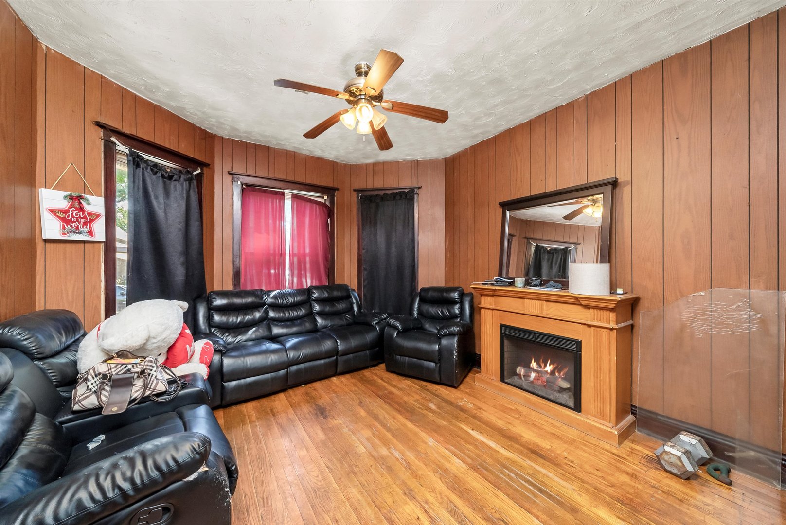 5758 South Honore Street Chicago, IL 60636 - Photo 37 of 57 a living room with furniture a fireplace and a flat screen tv