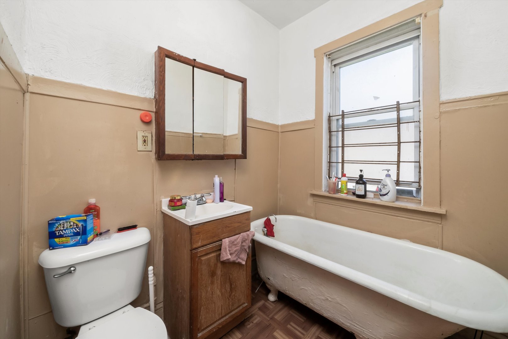 5758 South Honore Street Chicago, IL 60636 - Photo 39 of 57 a bathroom with a sink a toilet and tub