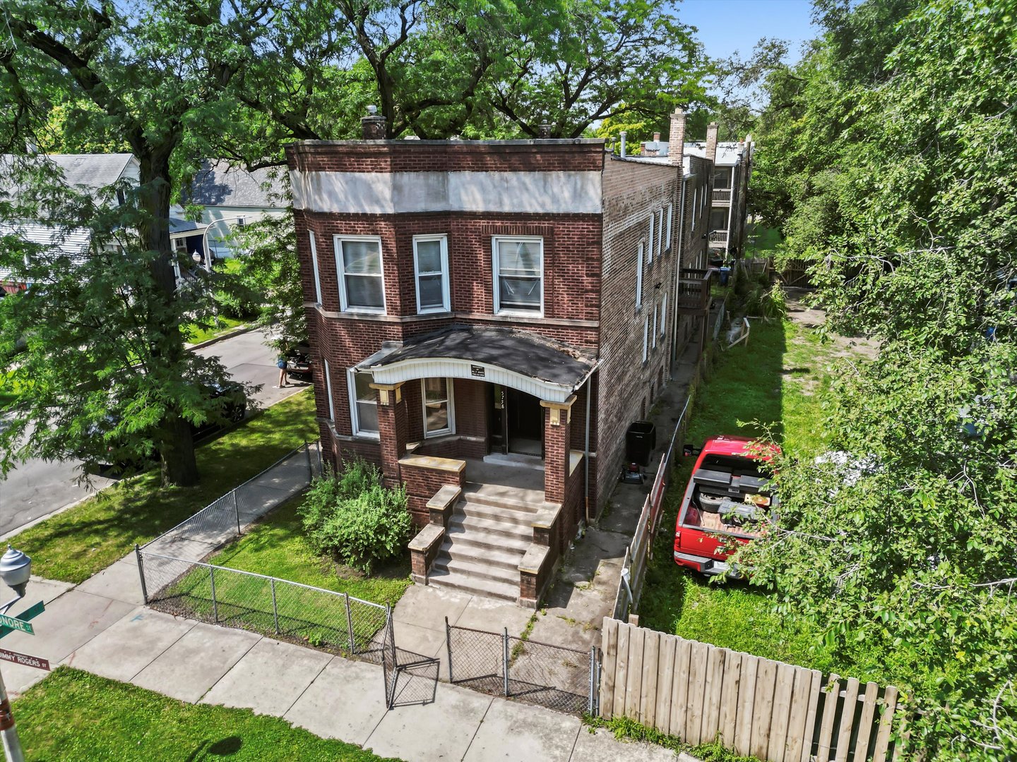 5758 South Honore Street Chicago, IL 60636 - Photo 4 of 57 a front view of house with yard and trees in the background