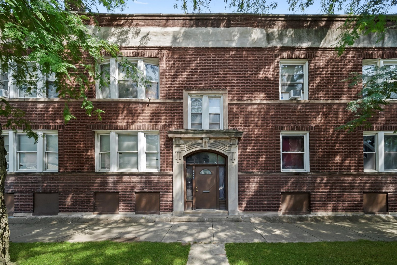 5758 South Honore Street Chicago, IL 60636 - Photo 46 of 57 a front view of a house with a yard