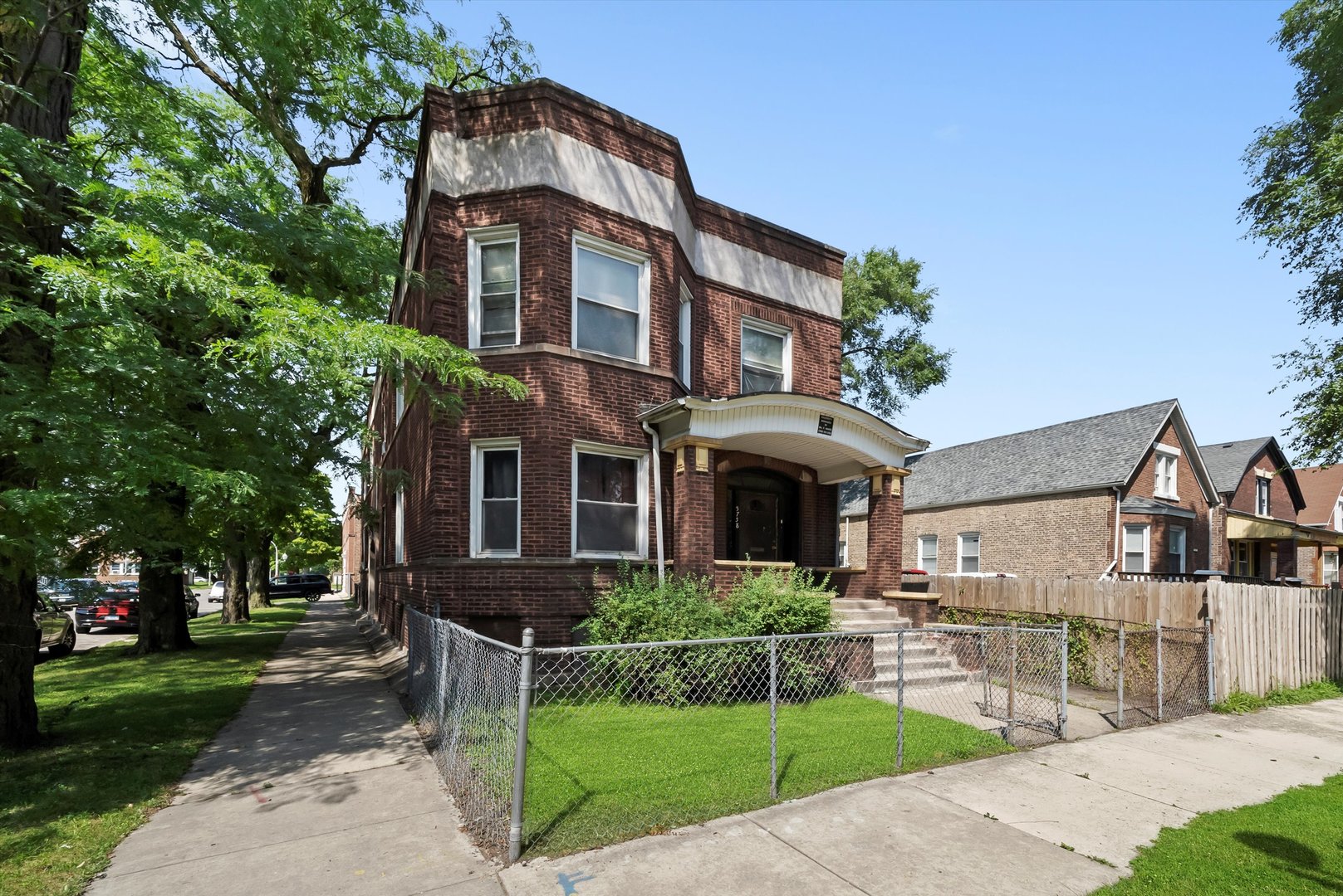 5758 South Honore Street Chicago, IL 60636 - Photo 47 of 57 a front view of a house with garden