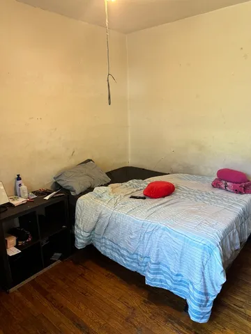 a bedroom with a bed and a closet