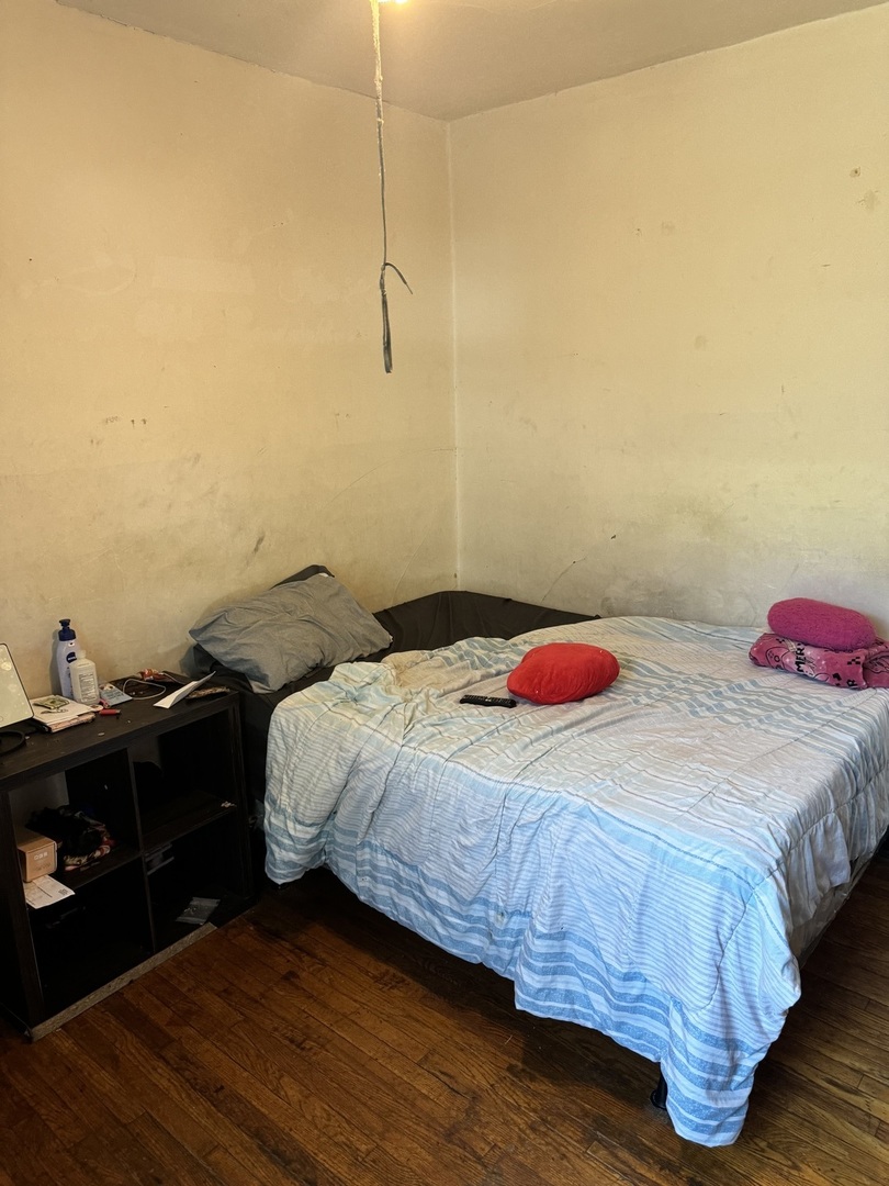 5758 South Honore Street Chicago, IL 60636 - Photo 8 of 57 a bedroom with a bed and a closet