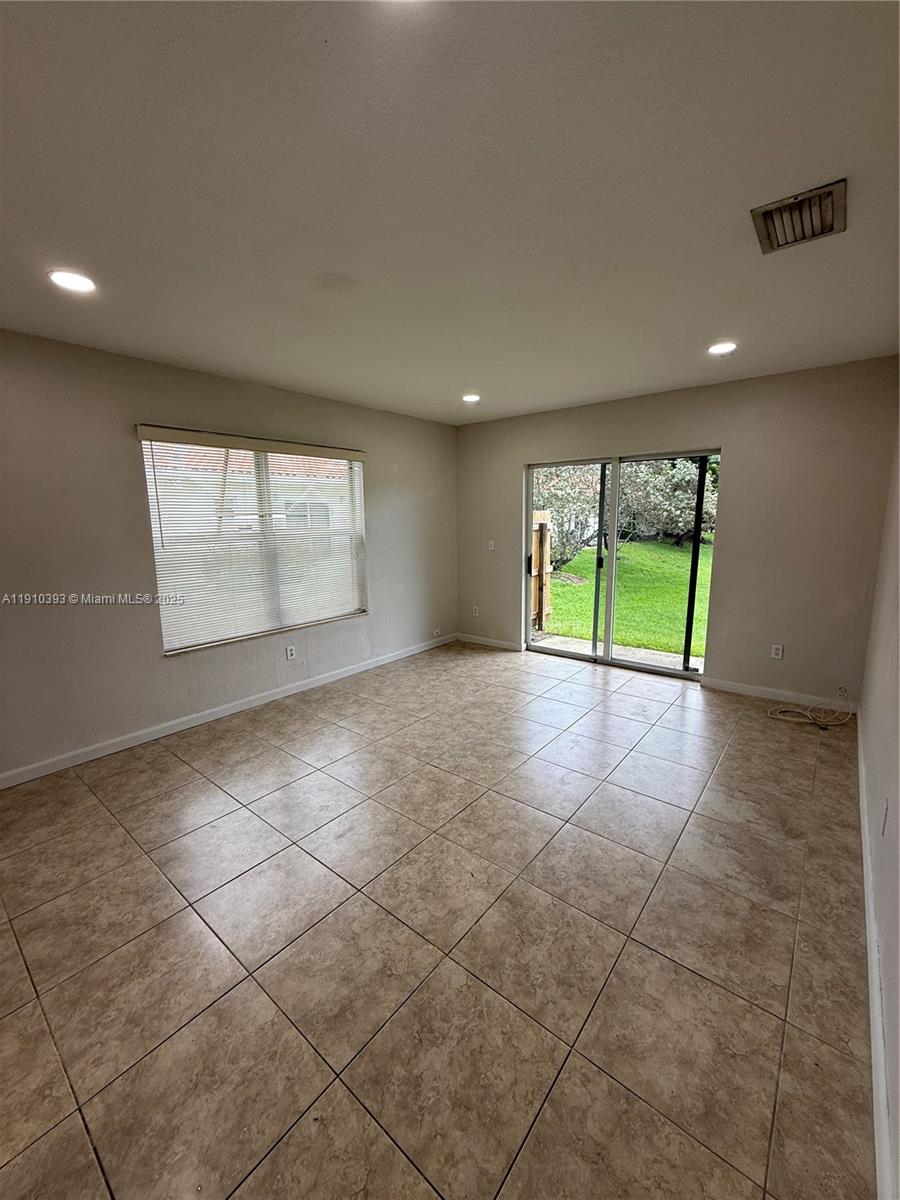 7612 Northwest 38th Court, Unit 13 Davie, FL 33024 - Photo 10 of 10 a view of an empty room with a window