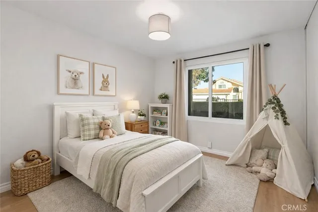 a bedroom with a bed and a window