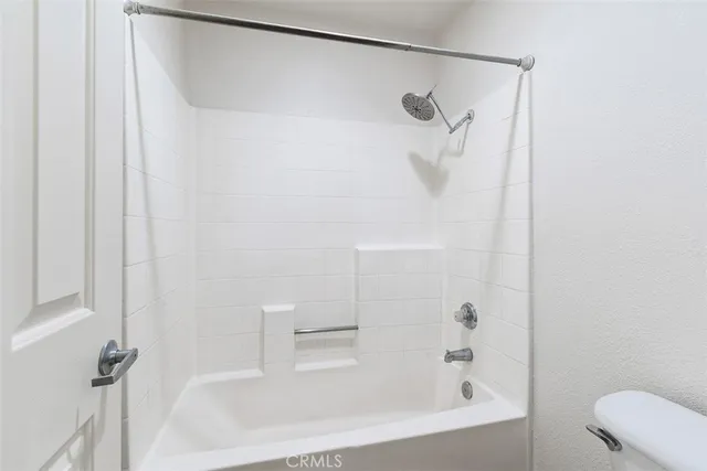 a bathroom with a shower and a shower