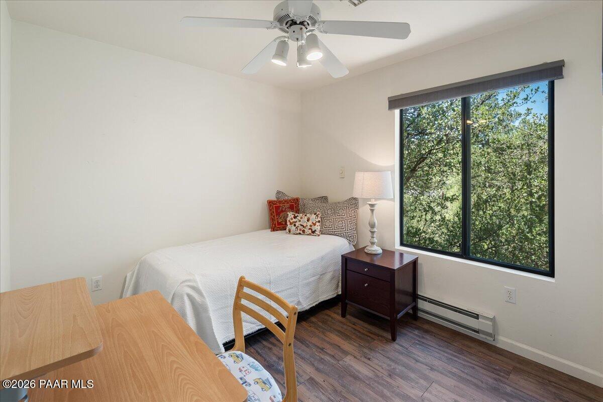 1388 East Pine Ridge Drive Prescott, AZ 86303 - Photo 10 of 16 a bed sitting in a bedroom next to a window