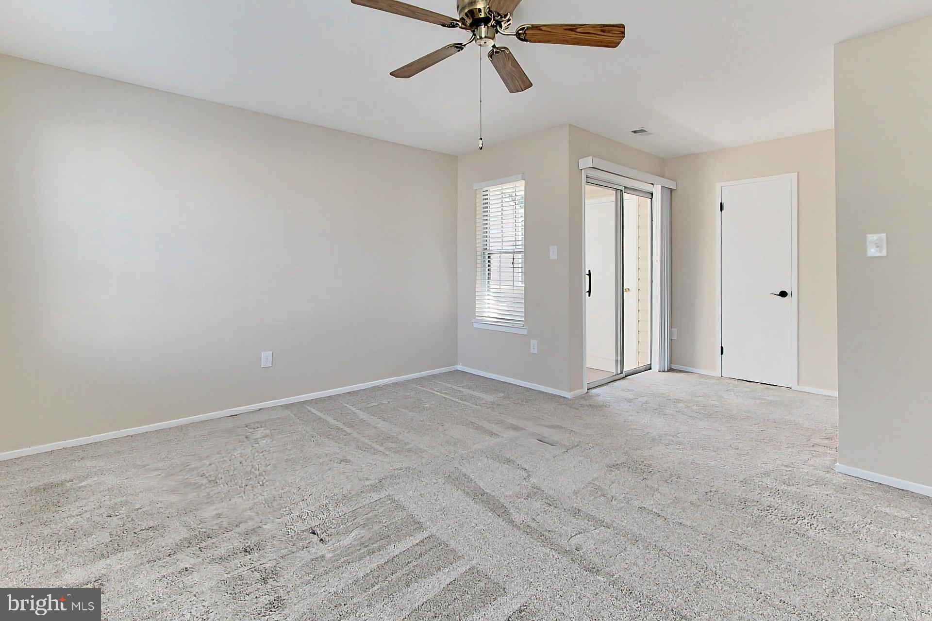 Primary bedroom, closet, and balcony in same space