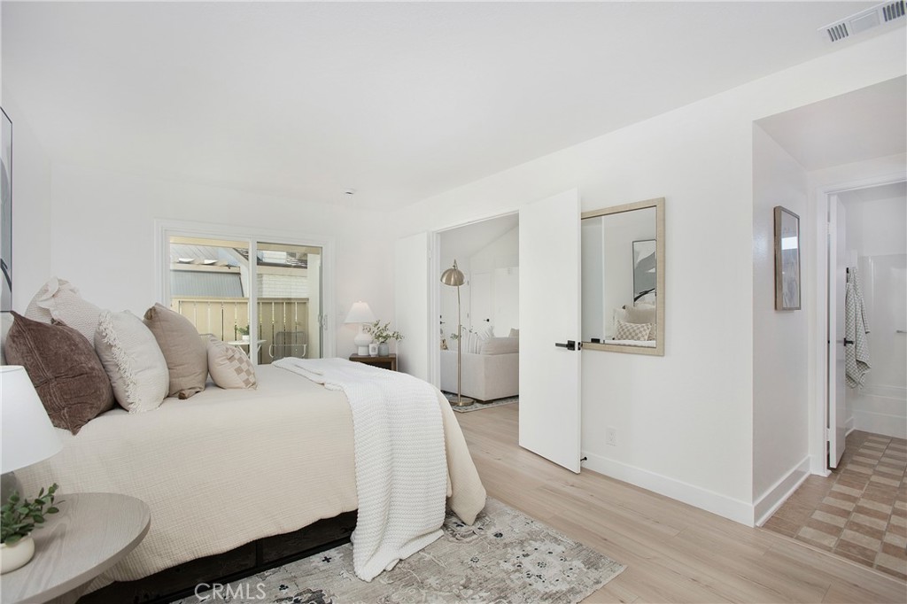316 Mountain Court Brea, CA 92821 - Photo 11 of 33 a spacious bedroom with a bed and wooden floor