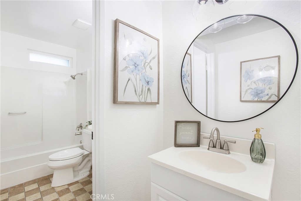 316 Mountain Court Brea, CA 92821 - Photo 12 of 33 a bathroom with a sink a toilet and a mirror