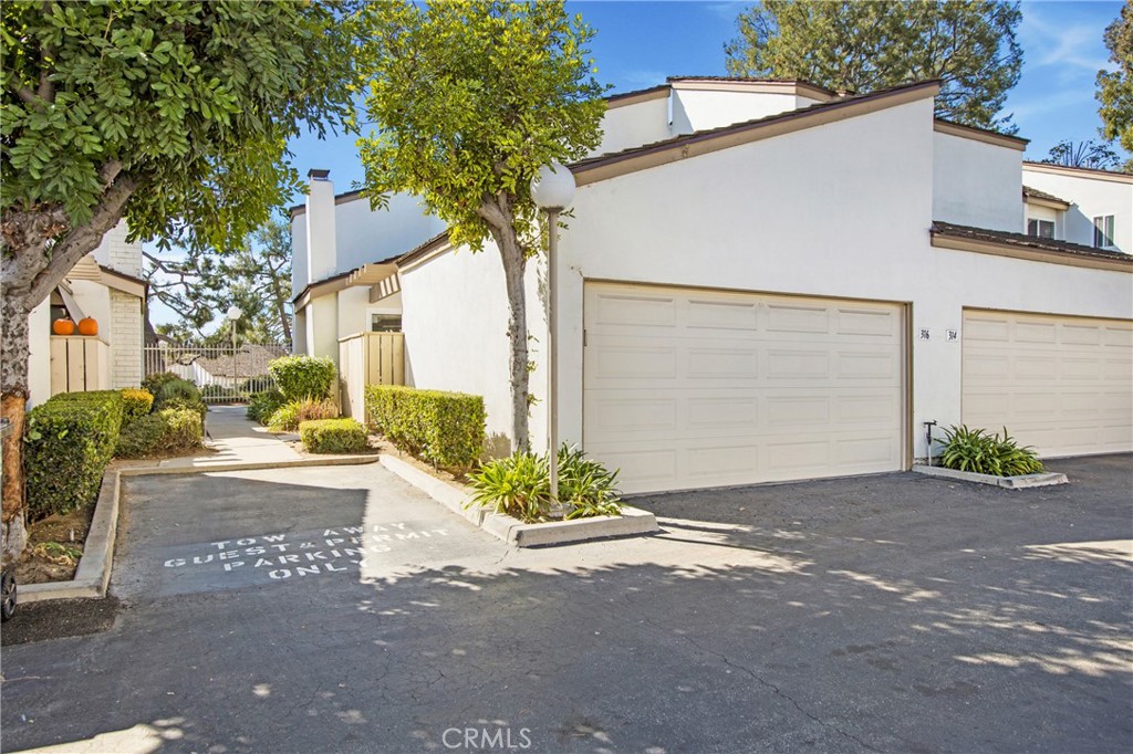 316 Mountain Court Brea, CA 92821 - Photo 25 of 33 a front view of a house with a yard and garage
