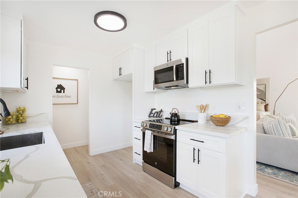 316 Mountain Court Brea, CA 92821 - Photo 8 of 33 a kitchen with stainless steel appliances a stove microwave and sink