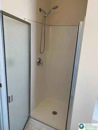 a bathroom with a bathtub and window