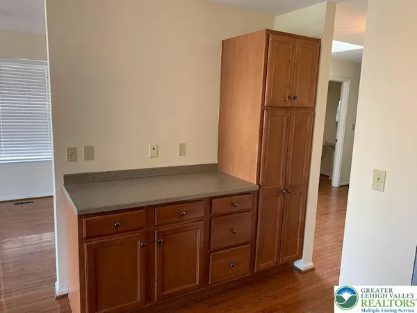 an empty room with wooden floor