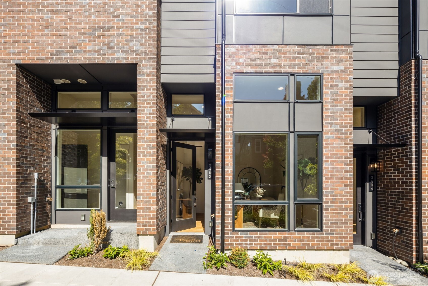 3406 East Spring Street Seattle, WA 98122 - Photo 2 of 10 a view of potted plants in front of a building