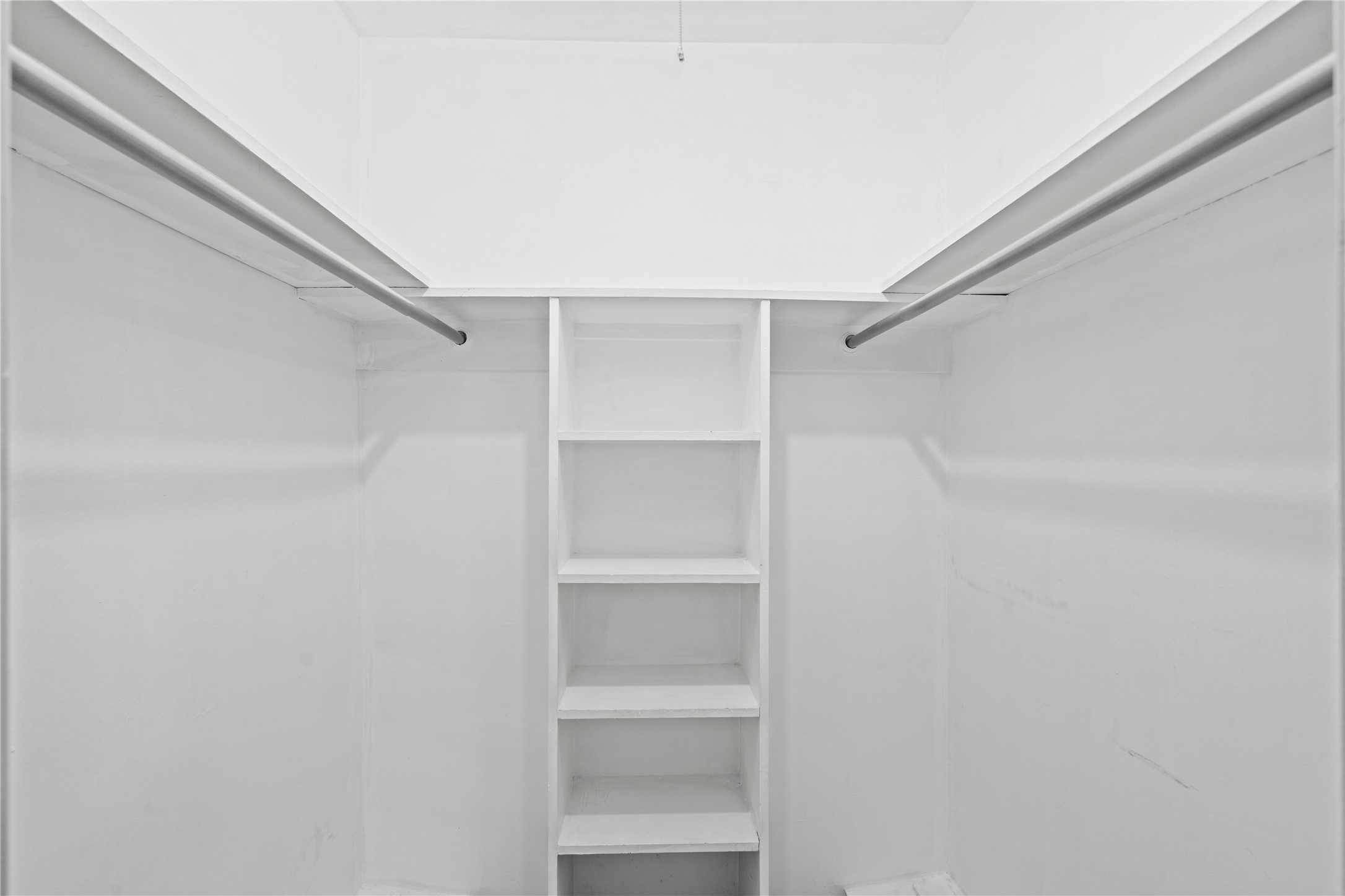 3924 West Alabama Street, Unit 4 Houston, TX 77027 - Photo 14 of 21 The closet in Bedroom 3 also includes some built-in shelving.