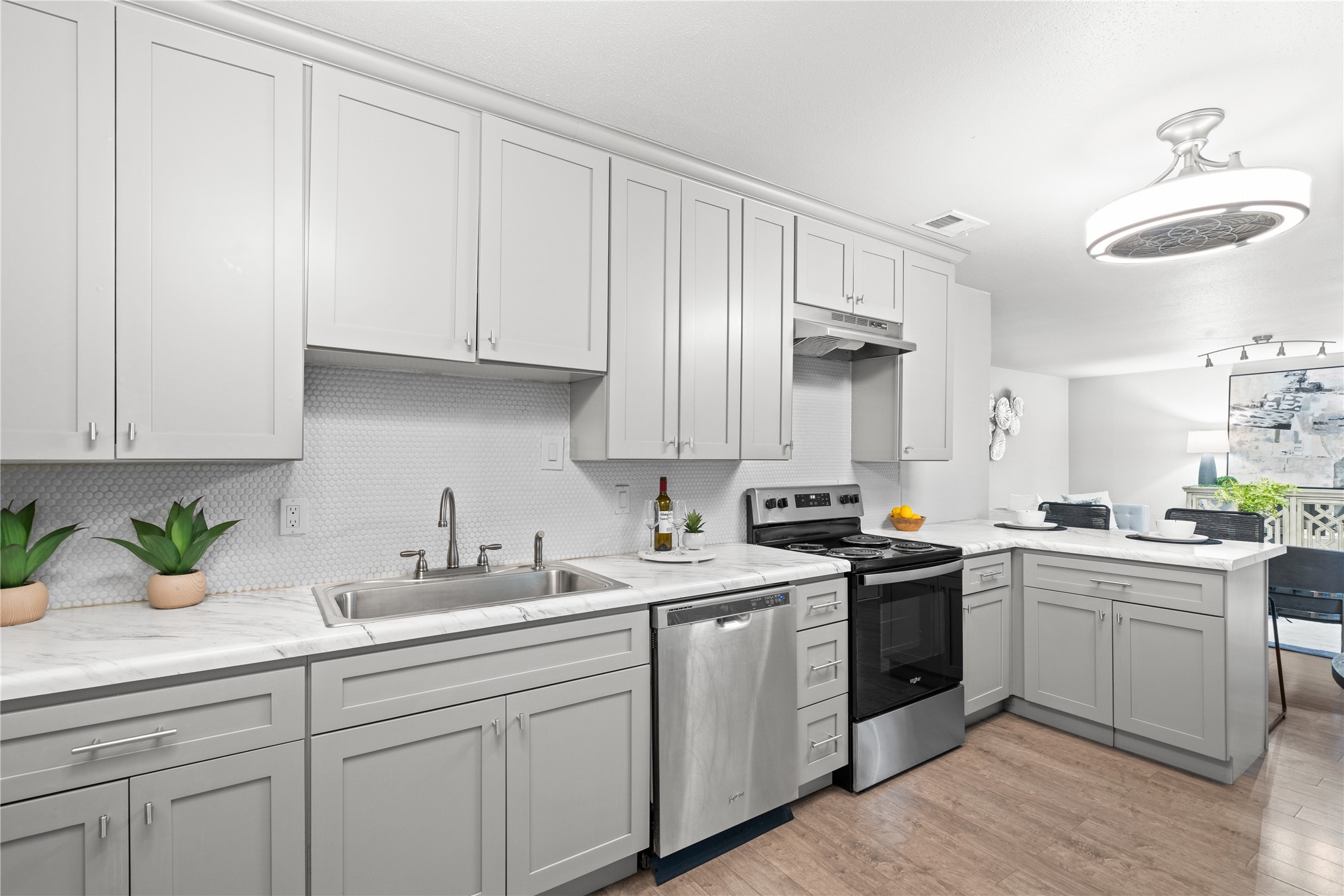 3924 West Alabama Street, Unit 4 Houston, TX 77027 - Photo 4 of 21 The kitchen features soft close cabinets and drawers and stainless steel appliances including a refrigerator that conveys with the home.