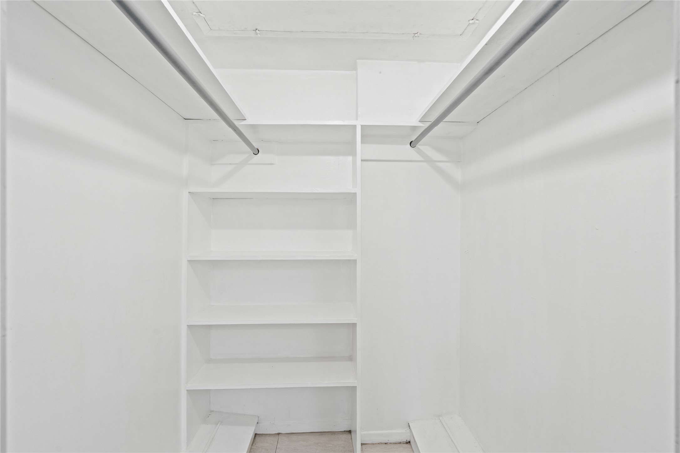 3924 West Alabama Street, Unit 4 Houston, TX 77027 - Photo 9 of 21 The walk-in closet features built-in shelving including shoe ledges.