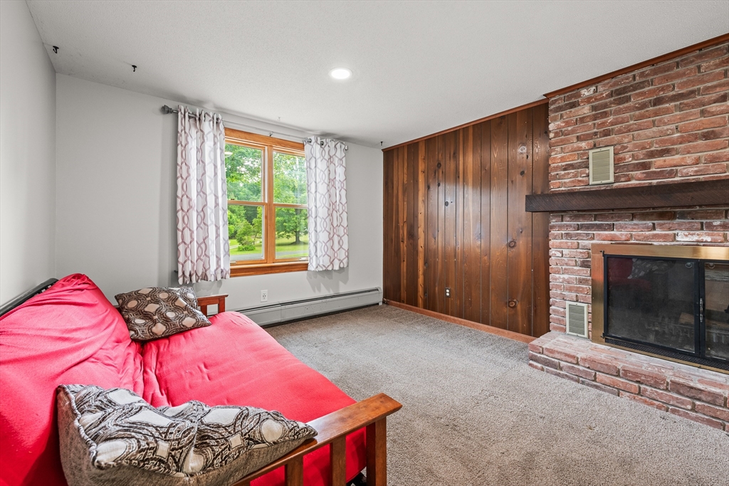 376 Chapin Road Hampden, MA 01036 - Photo 12 of 38 a bedroom with a bed and a fireplace