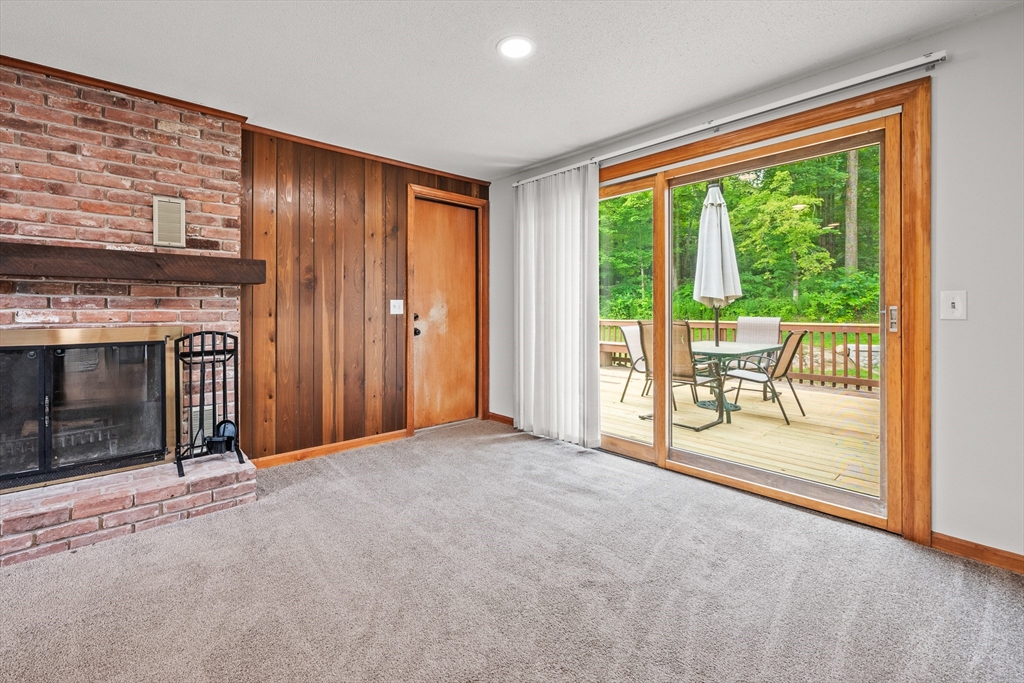 376 Chapin Road Hampden, MA 01036 - Photo 13 of 38 an empty room with furniture and a fireplace