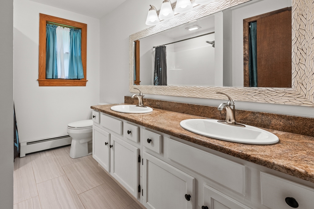376 Chapin Road Hampden, MA 01036 - Photo 18 of 38 a bathroom with a granite countertop double vanity sink and a mirror