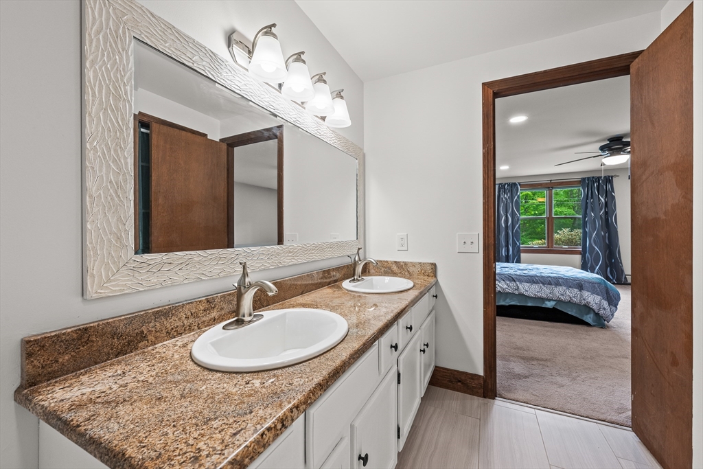 376 Chapin Road Hampden, MA 01036 - Photo 19 of 38 a en suite bathroom with a granite countertop sink and a mirror