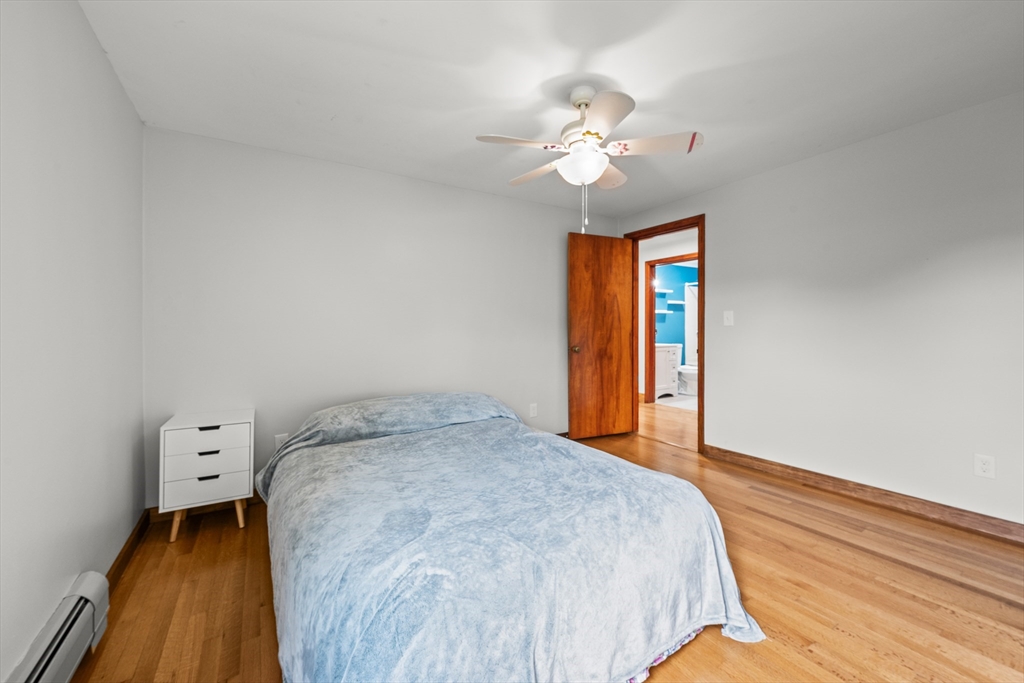 376 Chapin Road Hampden, MA 01036 - Photo 23 of 38 a bedroom with a bed and wooden floor