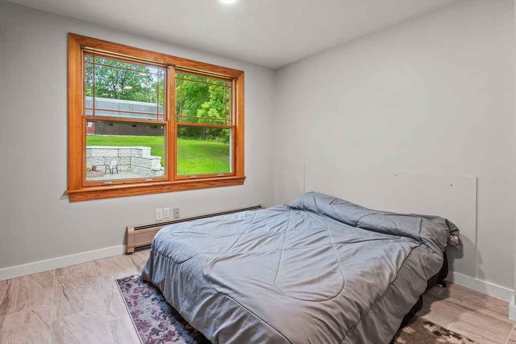 376 Chapin Road Hampden, MA 01036 - Photo 24 of 38 a bedroom with a bed and a window