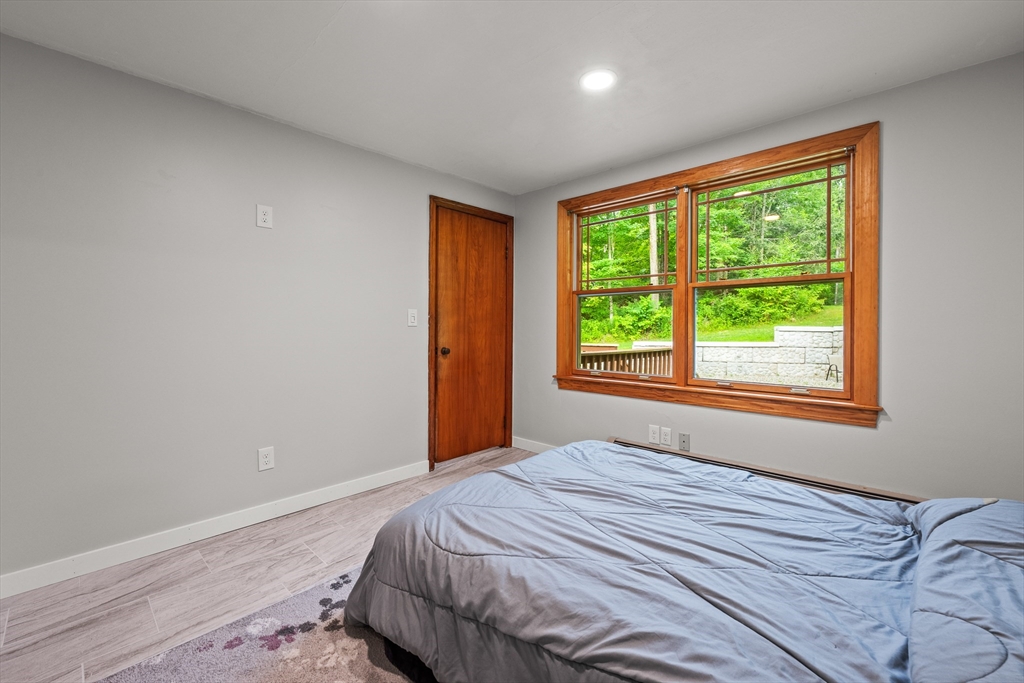 376 Chapin Road Hampden, MA 01036 - Photo 25 of 38 a bedroom with a bed and a window