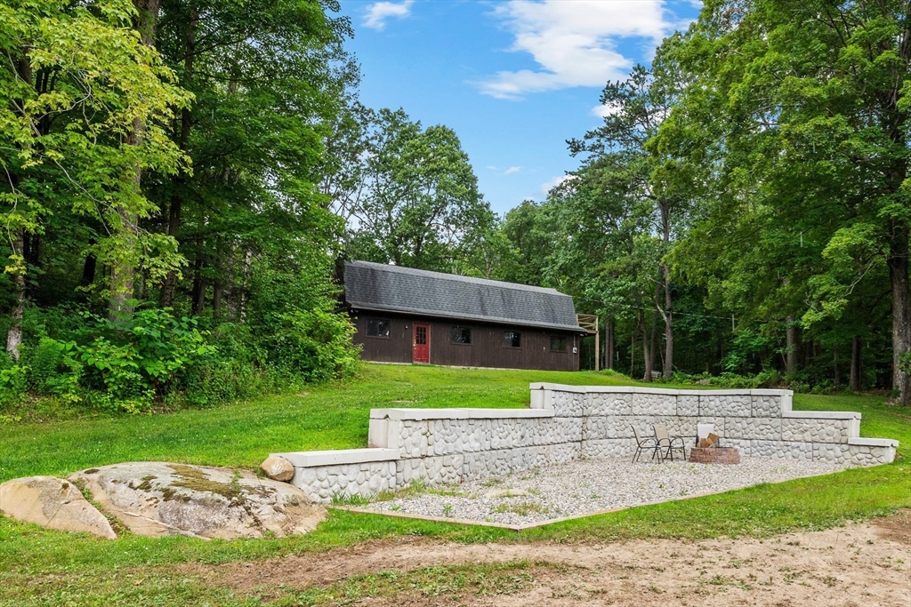 376 Chapin Road Hampden, MA 01036 - Photo 35 of 38 a view of a house with a yard and sitting area