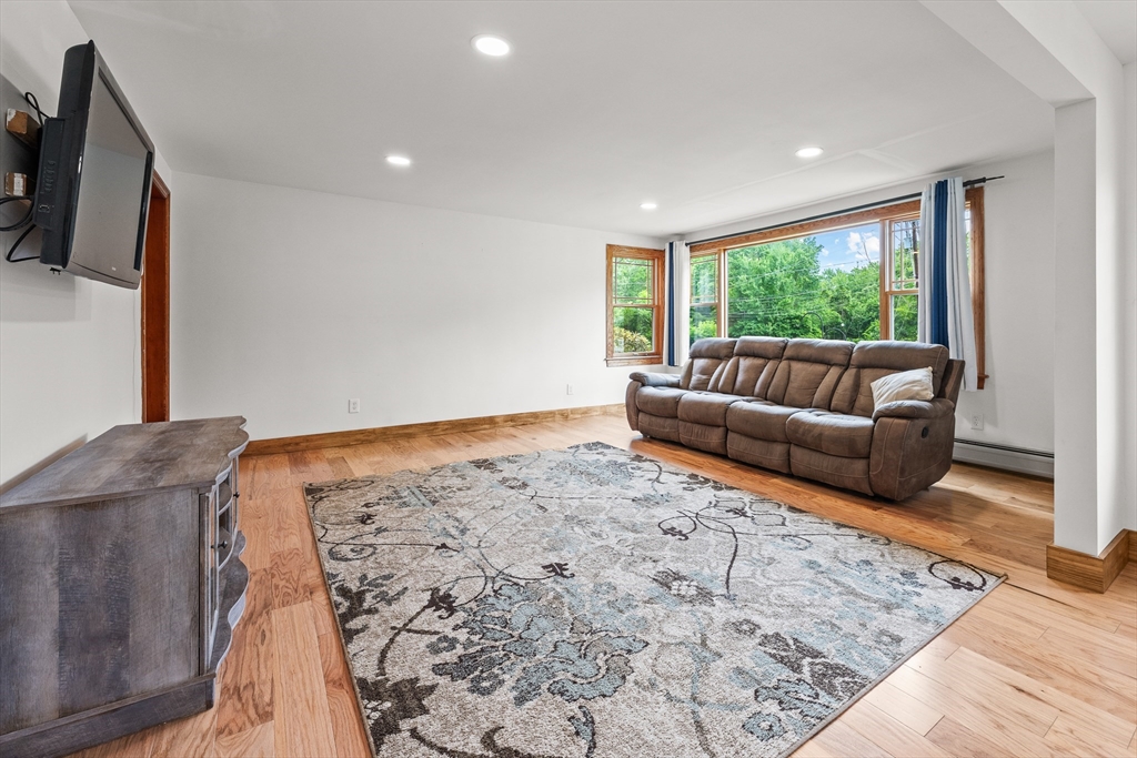 376 Chapin Road Hampden, MA 01036 - Photo 6 of 38 a living room with furniture and a flat screen tv