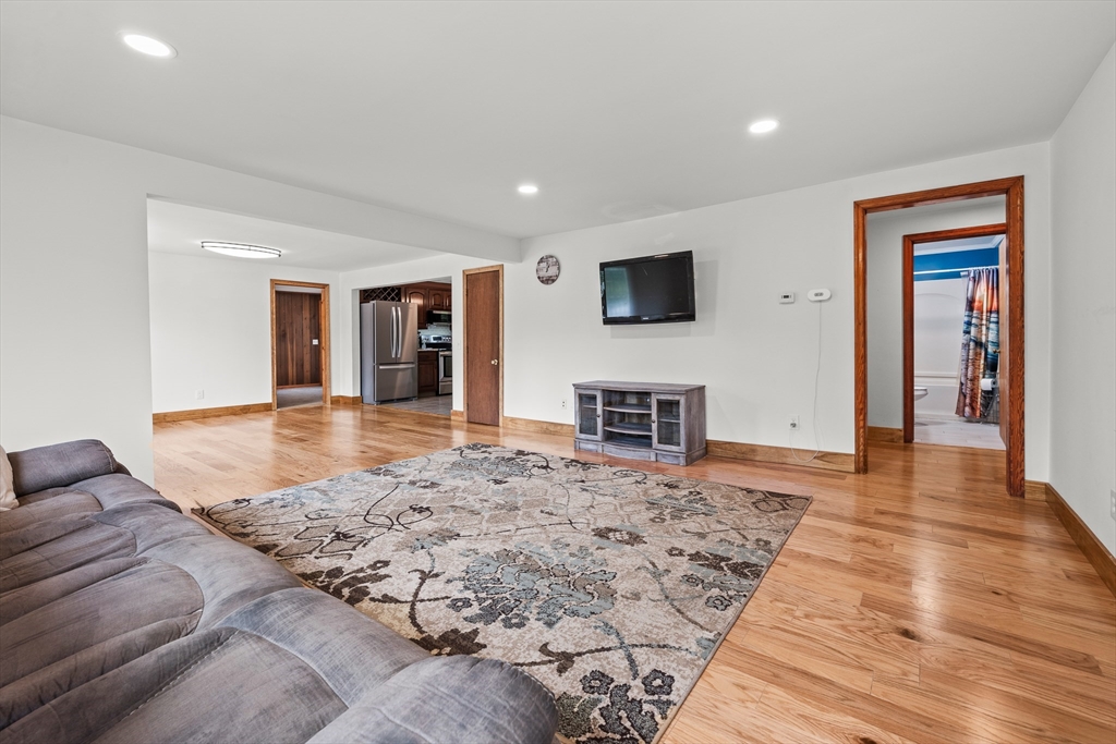 376 Chapin Road Hampden, MA 01036 - Photo 8 of 38 a living room with furniture and a flat screen tv