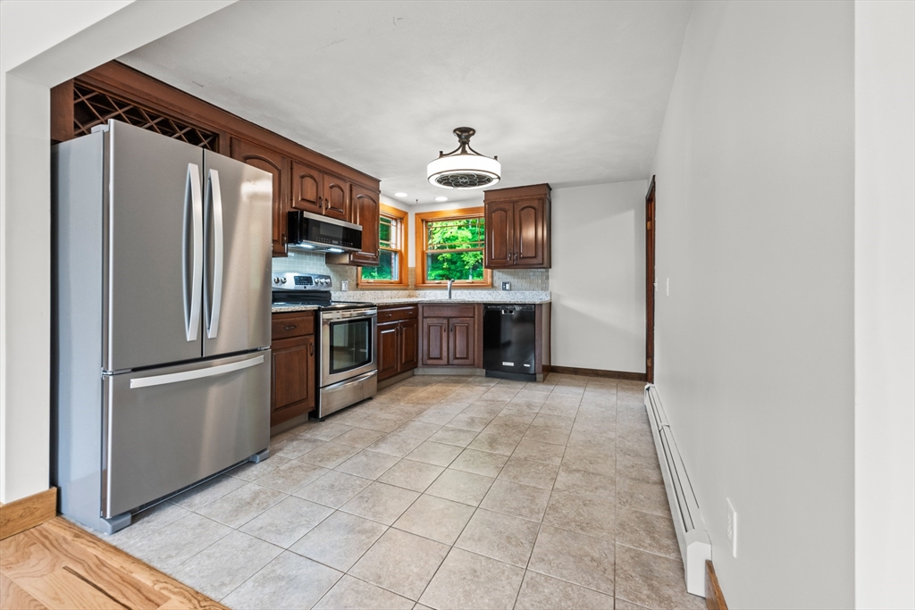 376 Chapin Road Hampden, MA 01036 - Photo 9 of 38 a kitchen with stainless steel appliances a refrigerator sink and microwave