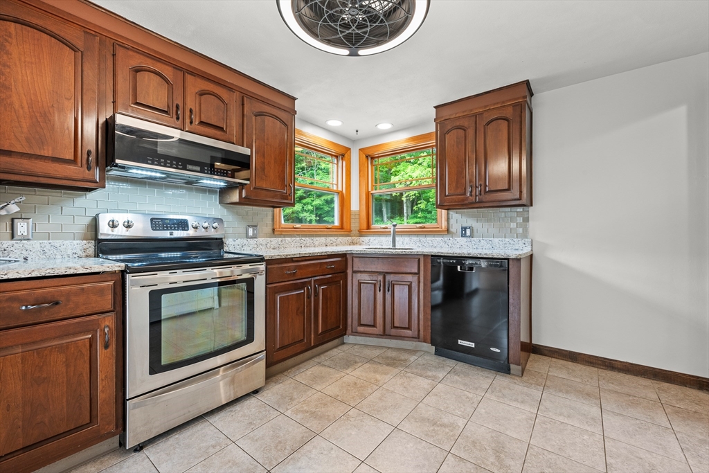 376 Chapin Road Hampden, MA 01036 - Photo 10 of 38 a kitchen with stainless steel appliances granite countertop a stove top oven a sink dishwasher and cabinets