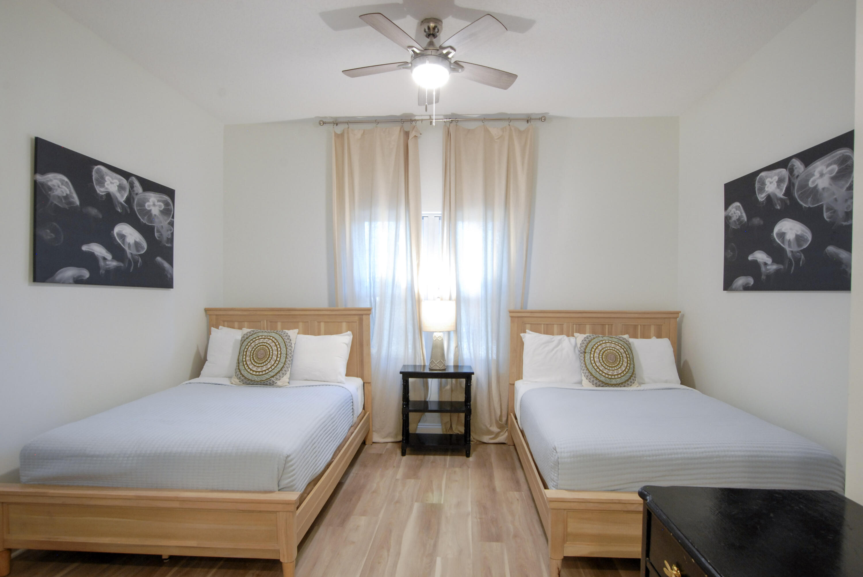 9961 East County Highway 30A, Unit 201 Inlet Beach, FL 32461 - Photo 12 of 19 a bedroom with a large bed and a chandelier