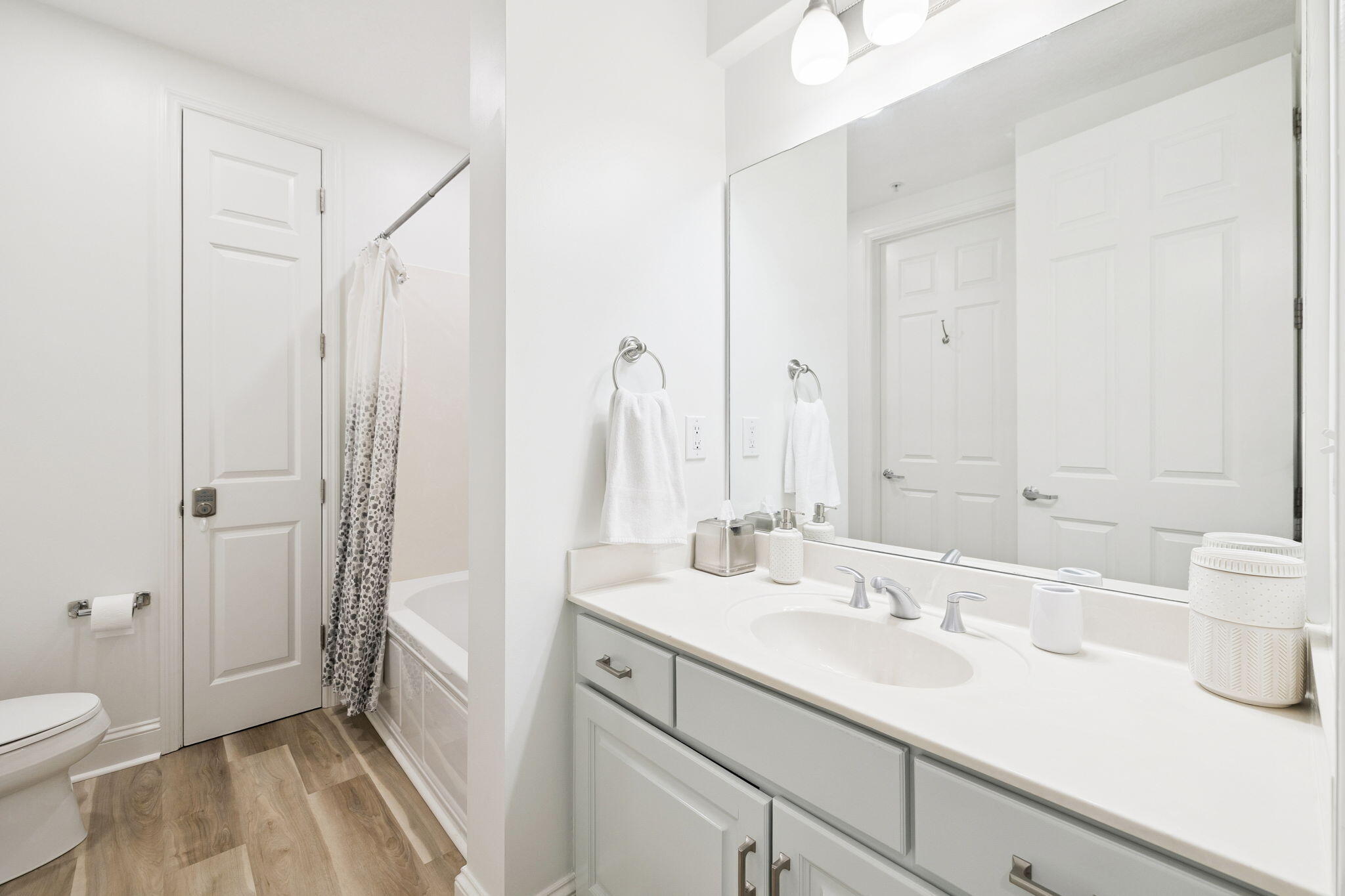 9961 East County Highway 30A, Unit 201 Inlet Beach, FL 32461 - Photo 20 of 35 a bathroom with a sink a toilet and a large mirror