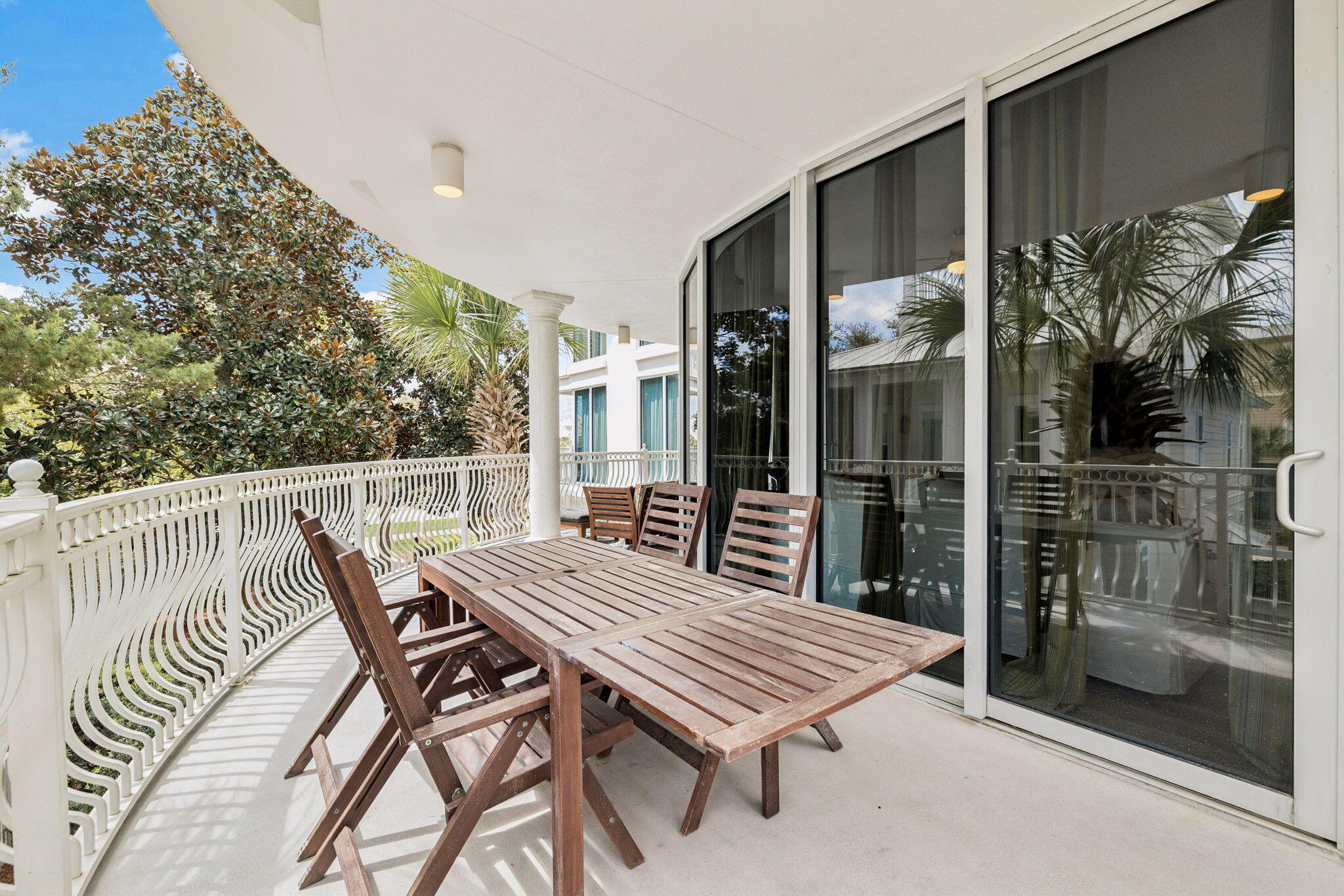 9961 East County Highway 30A, Unit 201 Inlet Beach, FL 32461 - Photo 24 of 35 a view of a patio with a table and chairs