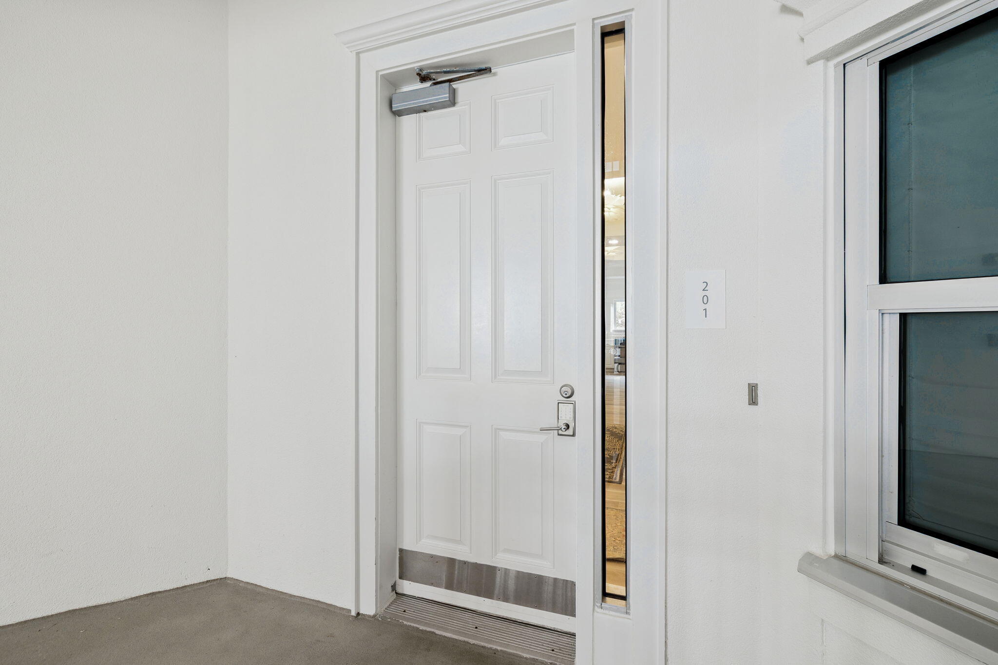 9961 East County Highway 30A, Unit 201 Inlet Beach, FL 32461 - Photo 29 of 35 a view of a livingroom with wooden floor and closet area