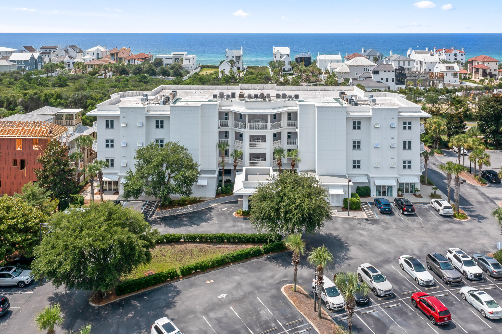 9961 East County Highway 30A, Unit 201 Inlet Beach, FL 32461 - Photo 30 of 35 an aerial view of a house with a yard and lake view